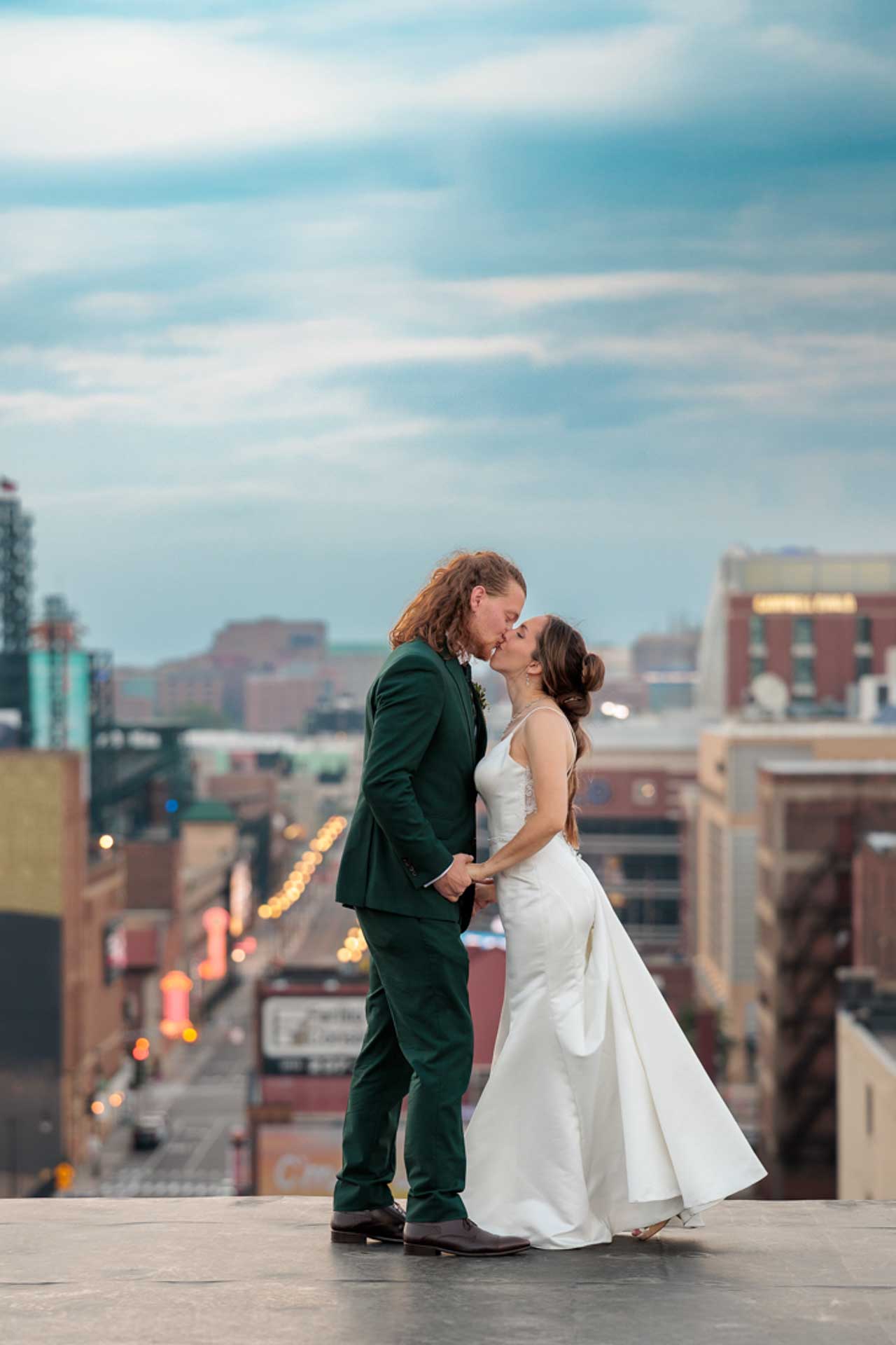 Downtown Detroit, Michigan Wedding Bride & Groom Kissing Rooftop by Olga Gamburg Photography